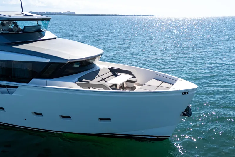 Slide: The Image of Luxurious interior of 2019 Sanlorenzo SX76 yacht with plush seating and large windows. - 10