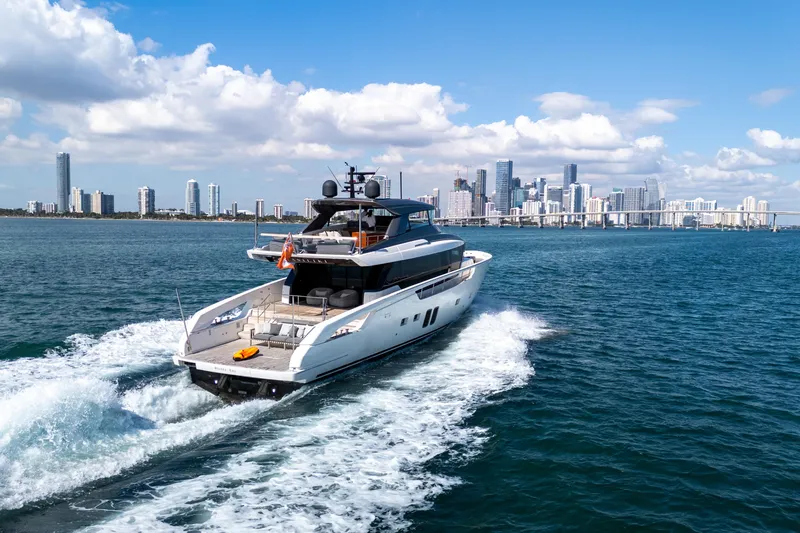 Slide: The Image of Luxurious 2019 Sanlorenzo SX76 yacht on serene blue waters, featuring spacious deck and modern design. - 6