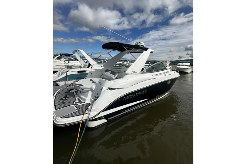 Slide: The Image of 2016 Monterey 295 Sport Yacht docked on a sunny day with blue skies. - 1