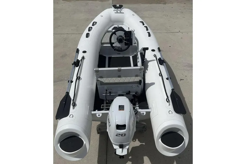The Image of Inflatable boat East Marine 320, 2026 model, with Tohatsu outboard motor, in showroom. - 0