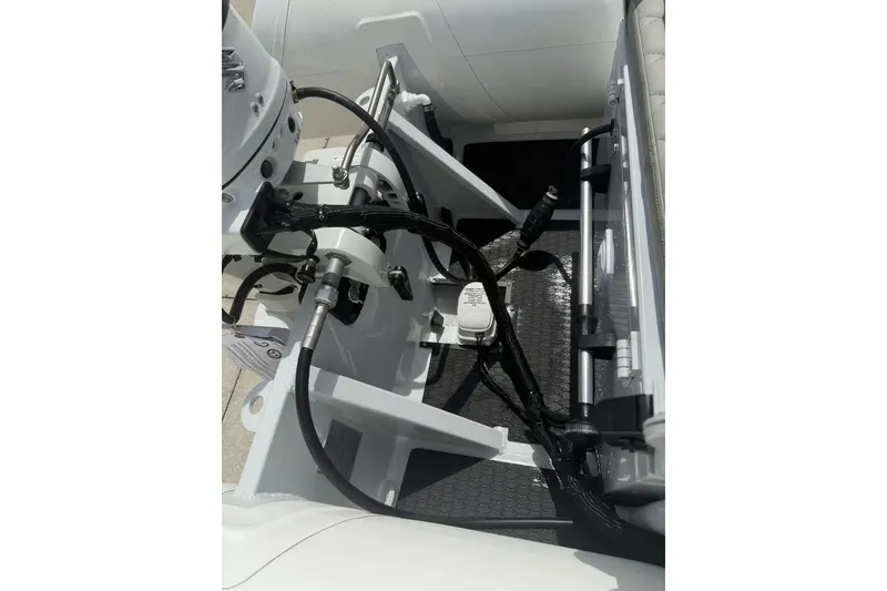 Slide: The Image of Manufacturer Provided Image: 2025 East Marine 320 boat engine detail on a metal stand, outdoor setting. - 10