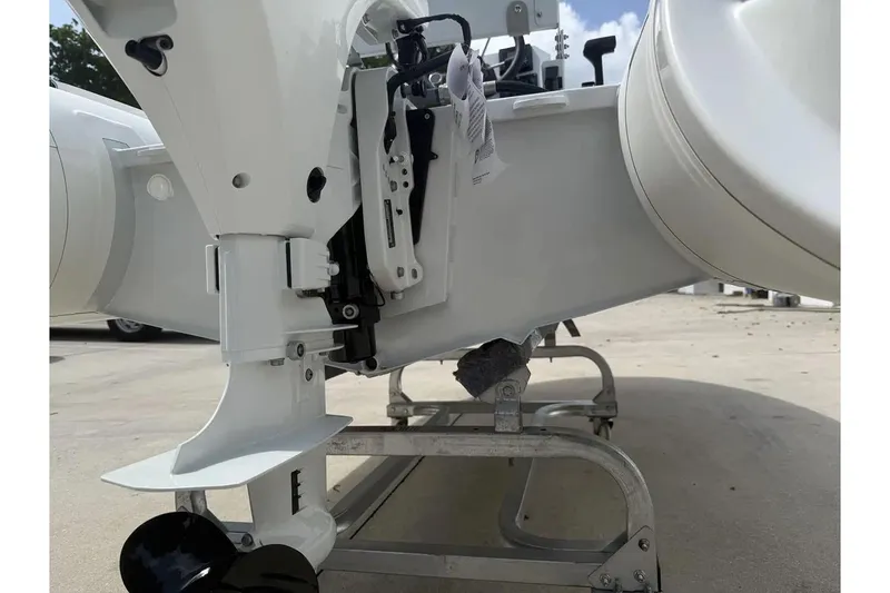 Slide: The Image of Manufacturer Provided Image: 2025 East Marine 320 inflatable boat interior with cushioned seating and storage compartment. - 6