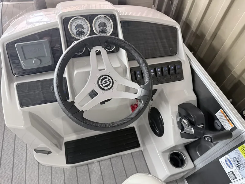 Slide: The Image of 2026 Sylvan Mirage 820 CLZ DH helm with steering wheel and gauges. - 9