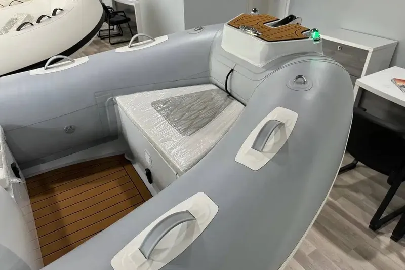 Slide: The Image of Inflatable boat East Marine 360, 2026 model, with seating and control panel. - 5