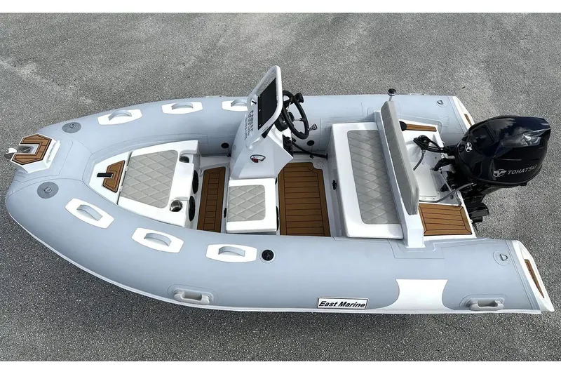 Slide: The Image of Manufacturer Provided Image: 2025 East Marine 360 inflatable boat with Tohatsu motor, featuring sleek design and comfortable seating. - 9
