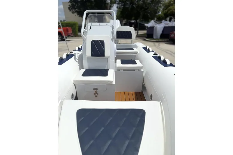 Slide: The Image of Manufacturer Provided Image: 2025 East Marine 390 boat interior with cushioned seating and modern design. - 4