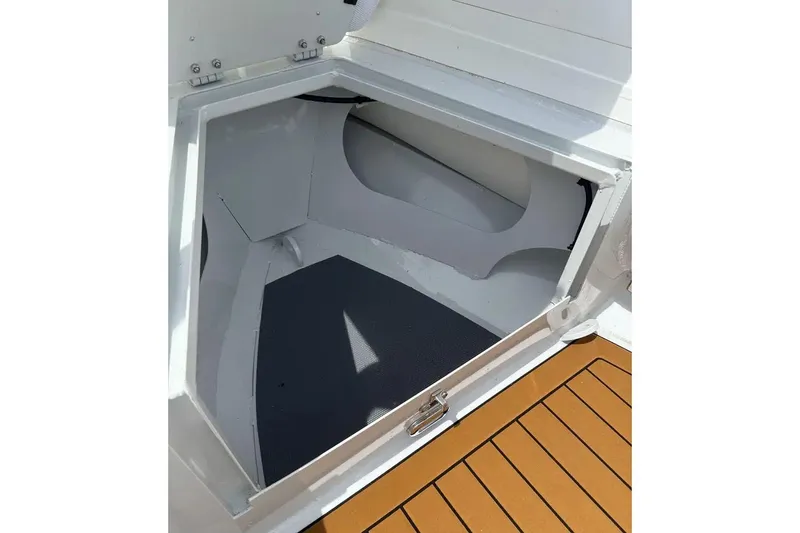 Slide: The Image of Manufacturer Provided Image: Steering console of 2025 East Marine 390 boat with modern controls and cup holder. - 6