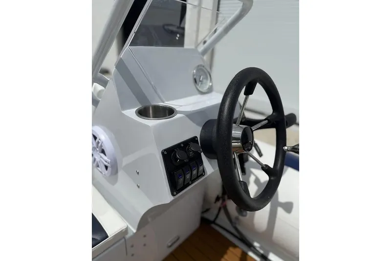 Slide: The Image of Manufacturer Provided Image: Close-up of 2025 East Marine 390 boat engine components on a stand. - 7