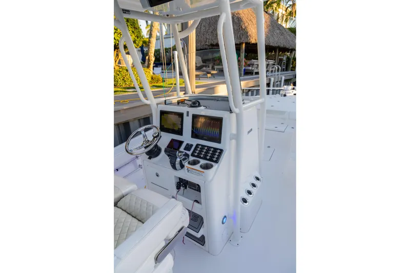 Slide: The Image of 2022 Caymas 28 HB Twin boat console with advanced navigation displays and controls. - 10