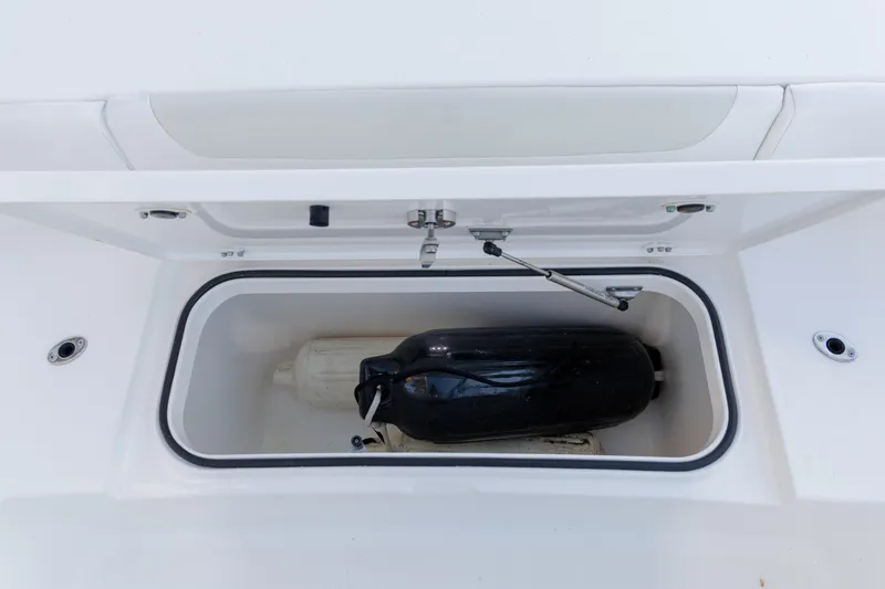 Slide: The Image of Storage compartment of 2022 Caymas 28 HB Twin boat with fender inside. - 15