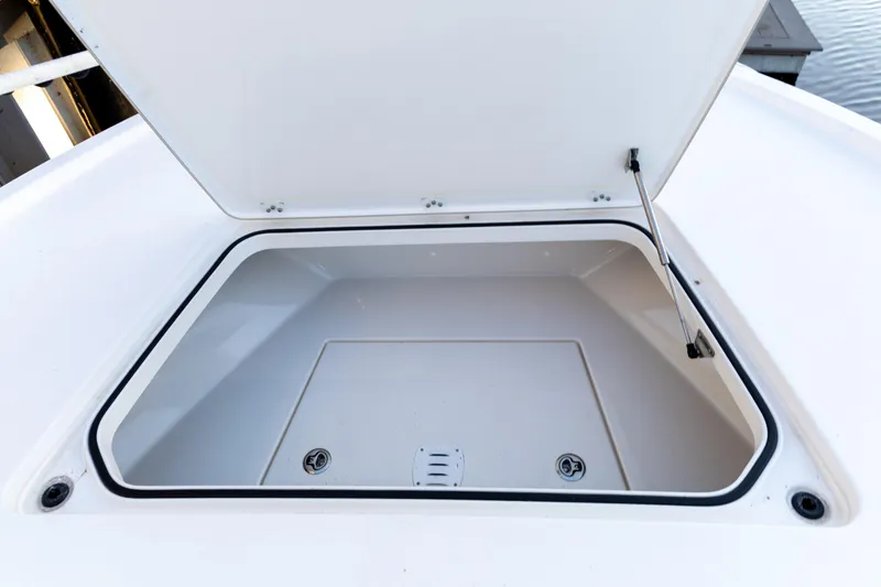 Slide: The Image of Open storage compartment on 2022 Caymas 28 HB Twin boat. - 16