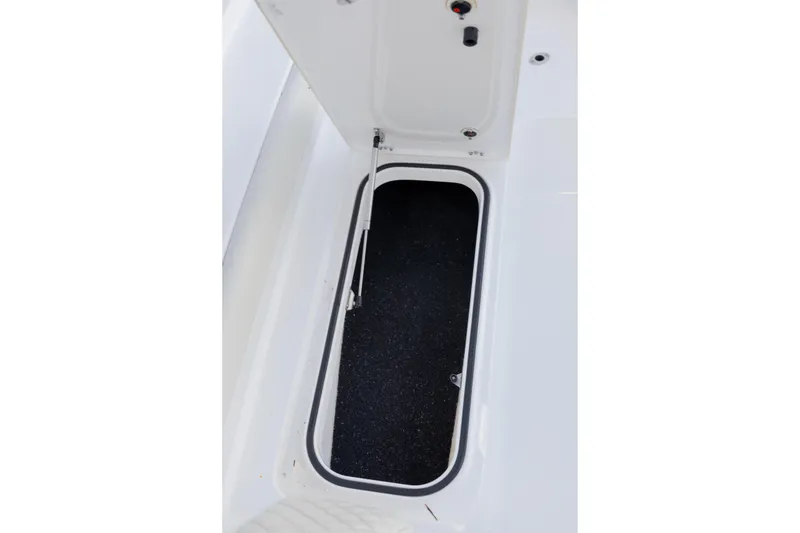 Slide: The Image of Open storage compartment on 2022 Caymas 28 HB Twin boat. - 18