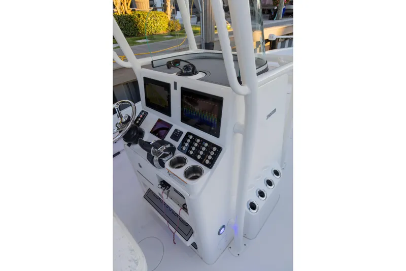 Slide: The Image of 2022 Caymas 28 HB Twin boat console with advanced navigation and control systems. - 21