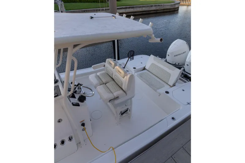Slide: The Image of 2022 Caymas 28 HB Twin boat interior with seating and Mercury engines. - 5