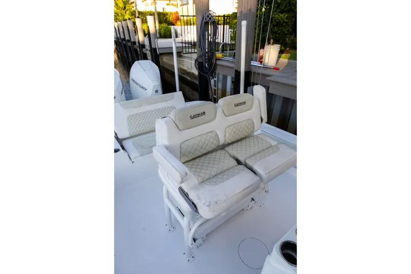 Slide: The Image of 2022 Caymas 28 HB Twin boat with cushioned seating and Mercury engines. - 8