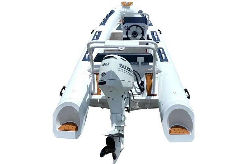 Slide: The Image of Manufacturer Provided Image: 2025 East Marine 420 inflatable boat with Suzuki outboard motor, rear view. - 7