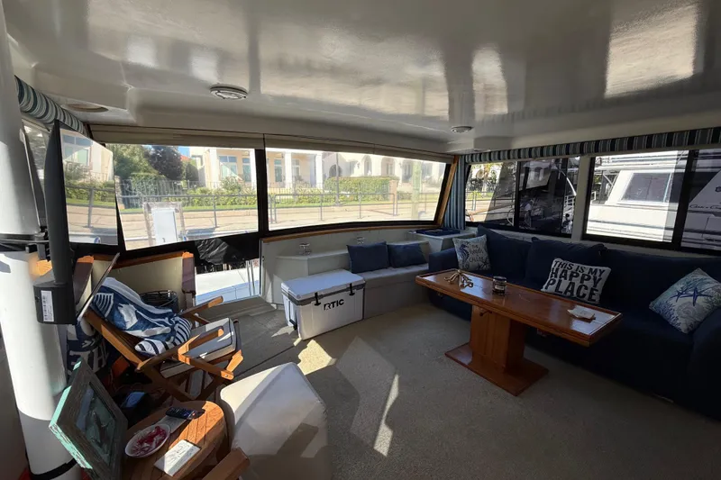 Slide: The Image of 1991 Californian 55 Cockpit Motor Yacht docked at marina, surrounded by other boats. - 14