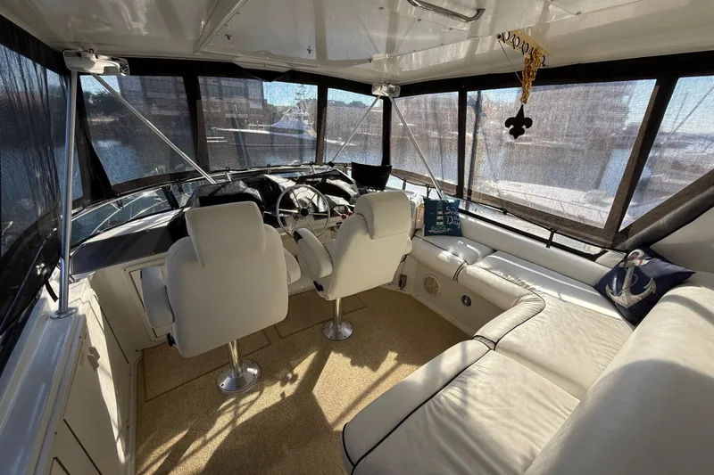 Slide: The Image of Luxurious interior of 1991 Californian 55 Cockpit Motor Yacht with elegant seating and decor. - 18