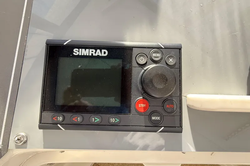 Slide: The Image of Control panel of a 1991 Californian 55 Cockpit Motor Yacht with throttle levers. - 21