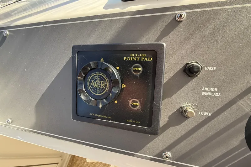 Slide: The Image of Cockpit view of 1991 Californian 55 Cockpit Motor Yacht with steering wheel and controls. - 24