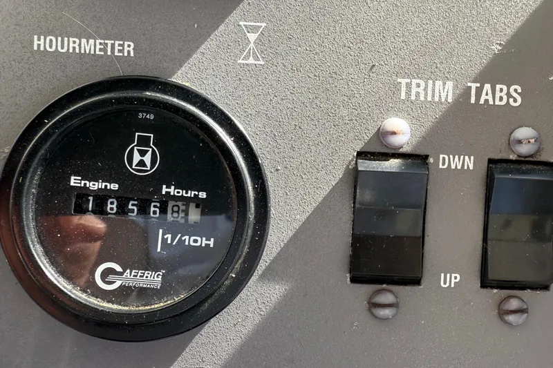 Slide: The Image of Cockpit of 1991 Californian 55 Cockpit Motor Yacht with steering wheel and control panel. - 26