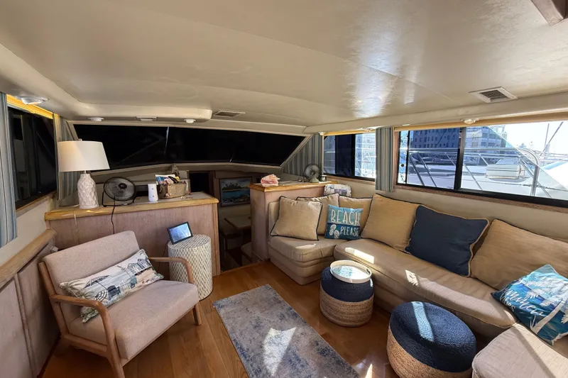 Slide: The Image of Interior of 1991 Californian 55 Cockpit Motor Yacht with cozy seating and nautical decor. - 35
