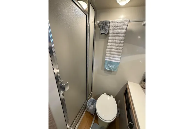 Slide: The Image of Bathroom interior of 1991 Californian 55 Cockpit Motor Yacht with shower and sink. - 49