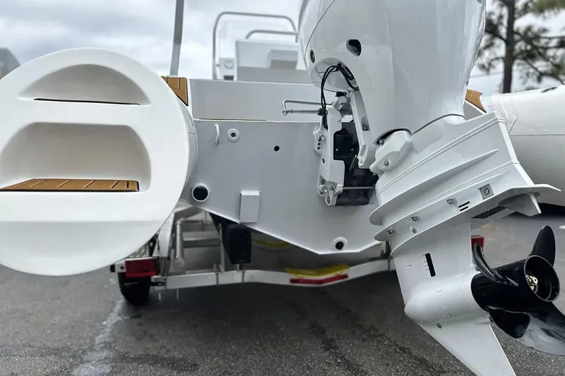 Slide: The Image of Manufacturer Provided Image: 2025 East Marine 560 boat with outboard motor, rear view on trailer. - 7