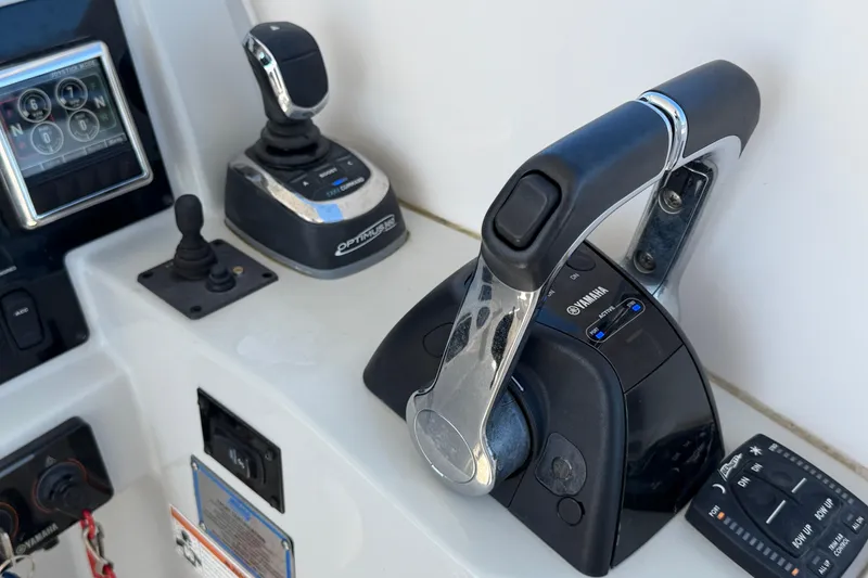 Slide: The Image of Control panel of 2021 Regal 33 SAV boat with Yamaha throttle and joystick. - 13