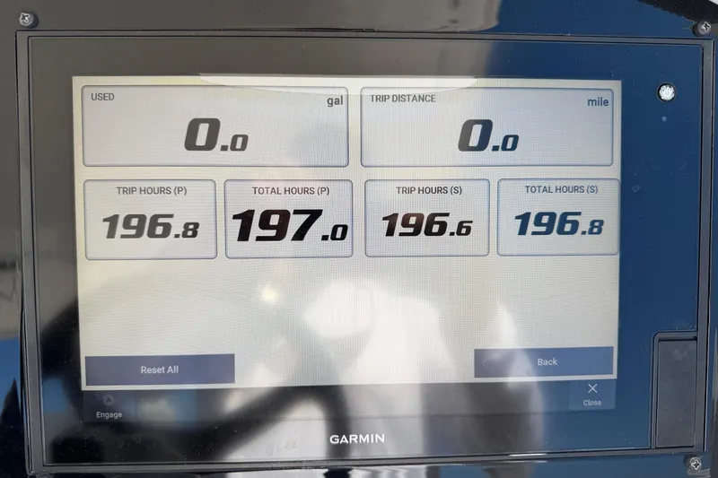 Slide: The Image of Garmin display showing trip and total hours for 2021 Regal 33 SAV boat. - 15