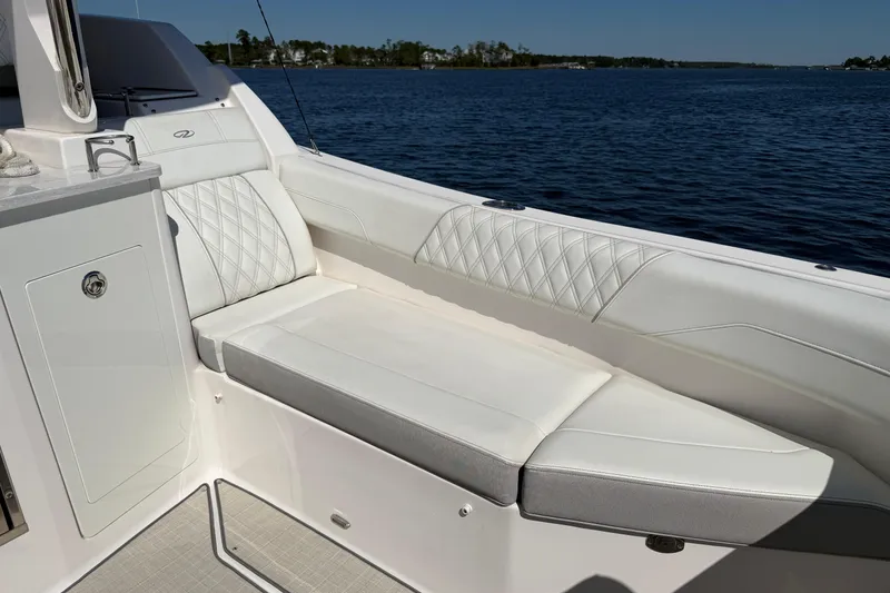 Slide: The Image of Luxurious seating on 2021 Regal 33 SAV boat with scenic water view. - 21