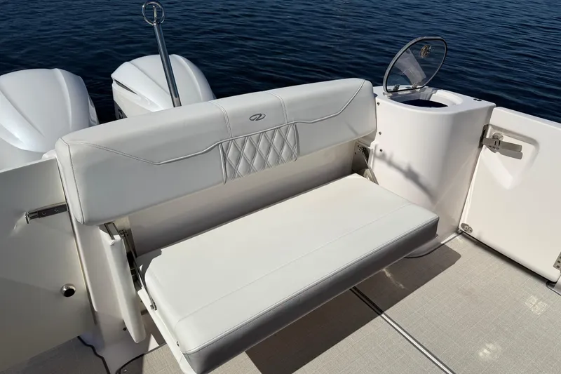 Slide: The Image of 2021 Regal 33 SAV boat with white seating and dual engines on water. - 22