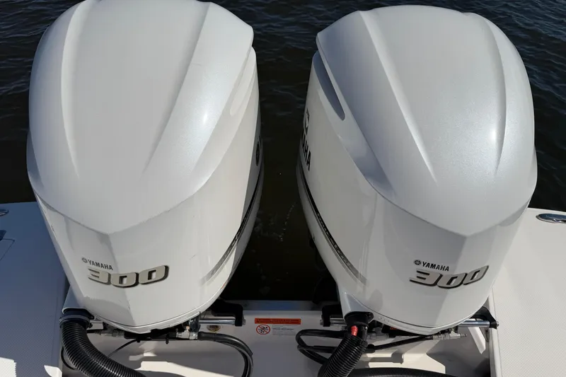 Slide: The Image of Twin Yamaha 300 outboard engines on a 2021 Regal 33 SAV boat. - 30