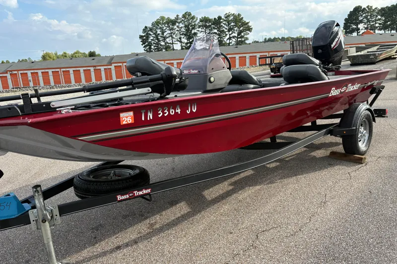 Slide: The Image of 2020 Tracker Bass Tracker Classic XL boat on trailer, red color, parked outdoors. - 42