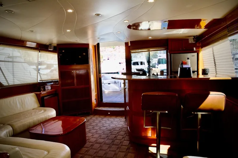 Slide: The Image of Luxurious interior of a 2002 Mikelson 50 Sportfisher yacht with elegant wood finishes. - 22