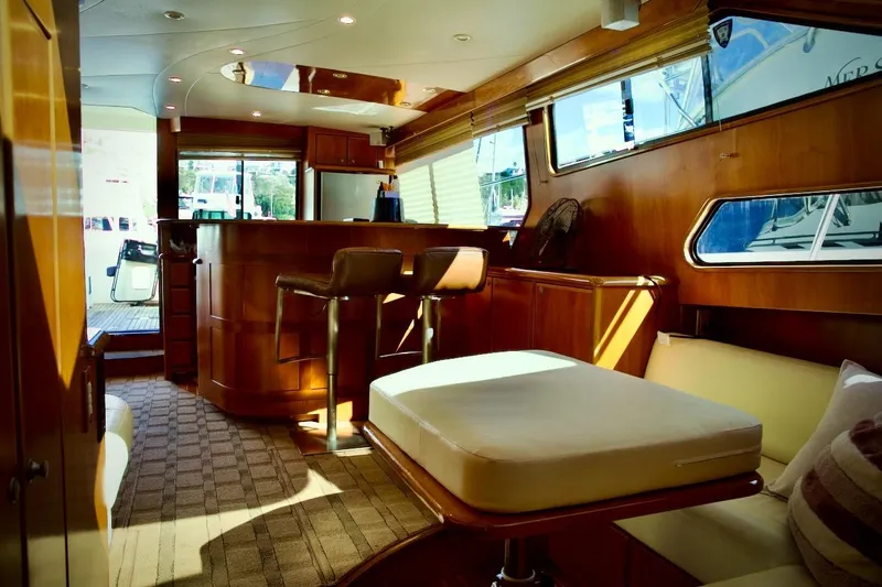 Slide: The Image of Luxurious interior of 2002 Mikelson 50 Sportfisher yacht with elegant wood finishes. - 23