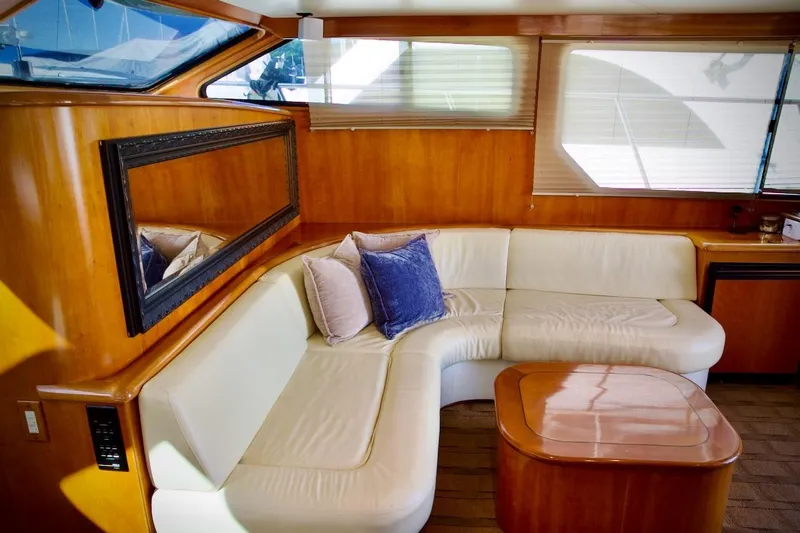 Slide: The Image of Luxurious interior of 2002 Mikelson 50 Sportfisher yacht with elegant seating and wooden accents. - 31