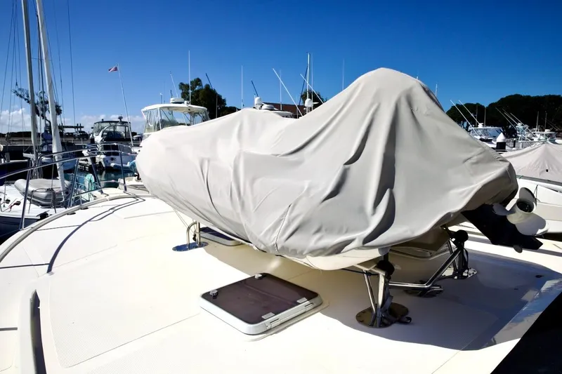 Slide: The Image of Covered equipment on 2002 Mikelson 50 Sportfisher yacht deck at marina. - 55