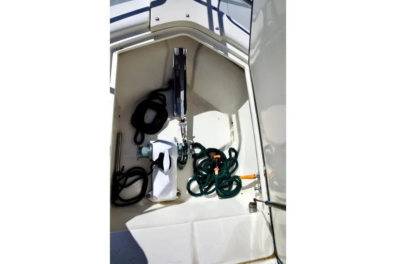 Slide: The Image of Anchor locker of 2002 Mikelson 50 Sportfisher with ropes and equipment. - 70