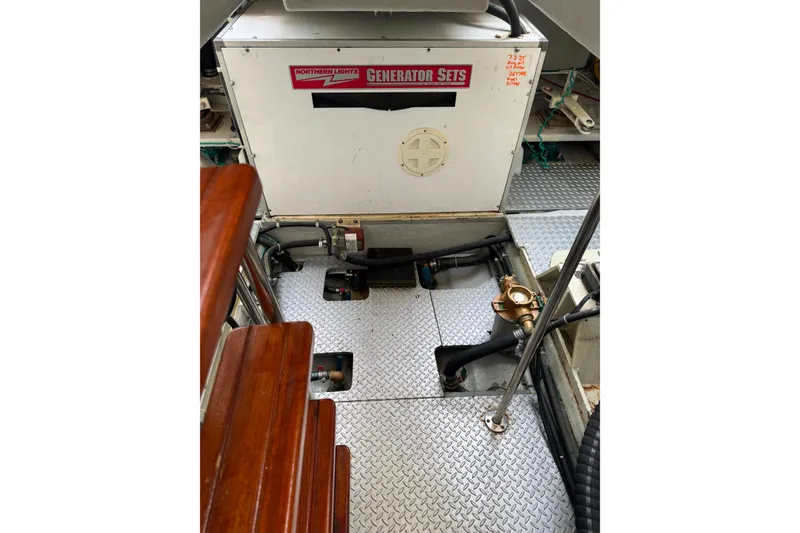 Slide: The Image of Engine room of 2002 Mikelson 50 Sportfisher with Northern Lights generator. - 75