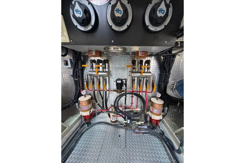 Slide: The Image of Engine room of 2002 Mikelson 50 Sportfisher with fuel system and gauges. - 76