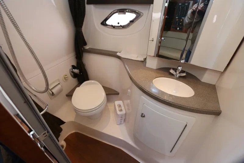 Slide: The Image of 2012 Regal 35 Sport Coupe bathroom with modern fixtures and compact design. - 100