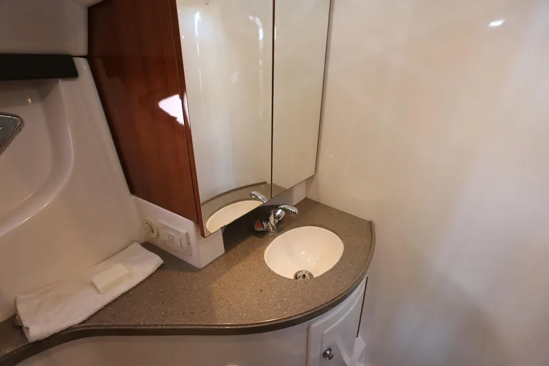 Slide: The Image of 2012 Regal 35 Sport Coupe bathroom with modern sink and mirror. - 103