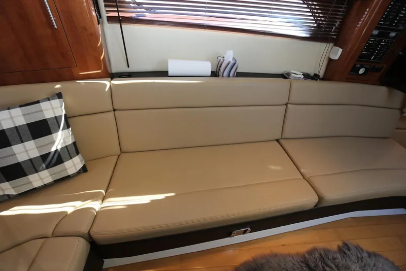 Slide: The Image of Luxurious interior of 2012 Regal 35 Sport Coupe with beige seating and plaid cushion. - 106