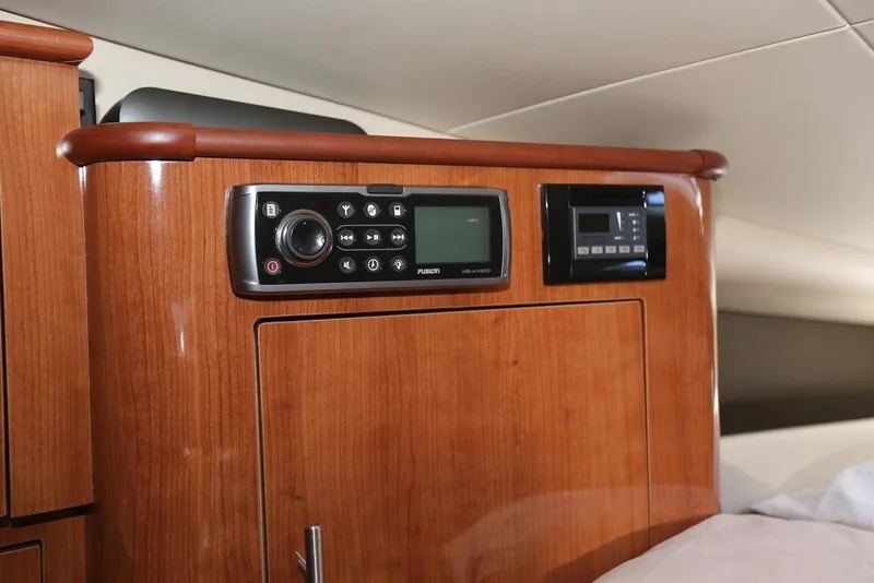 Slide: The Image of 2012 Regal 35 Sport Coupe interior with wood paneling and control systems. - 108