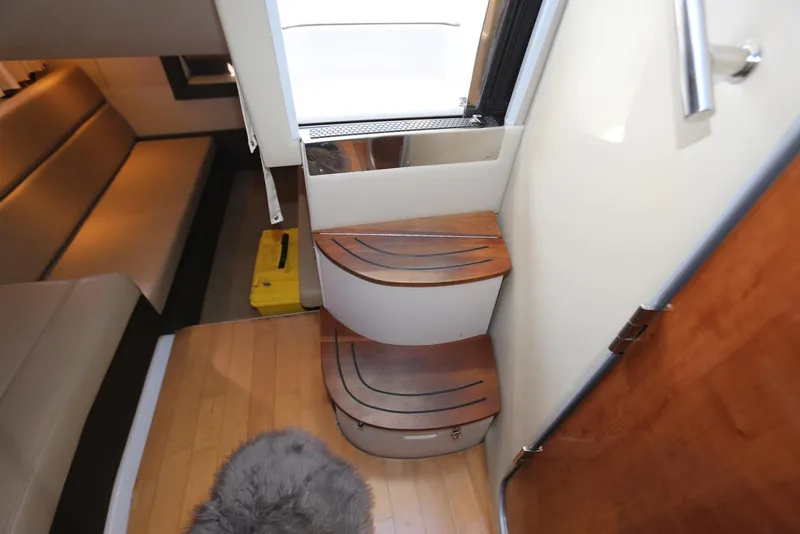 Slide: The Image of Interior stairs of 2012 Regal 35 Sport Coupe with wooden steps and modern design. - 109