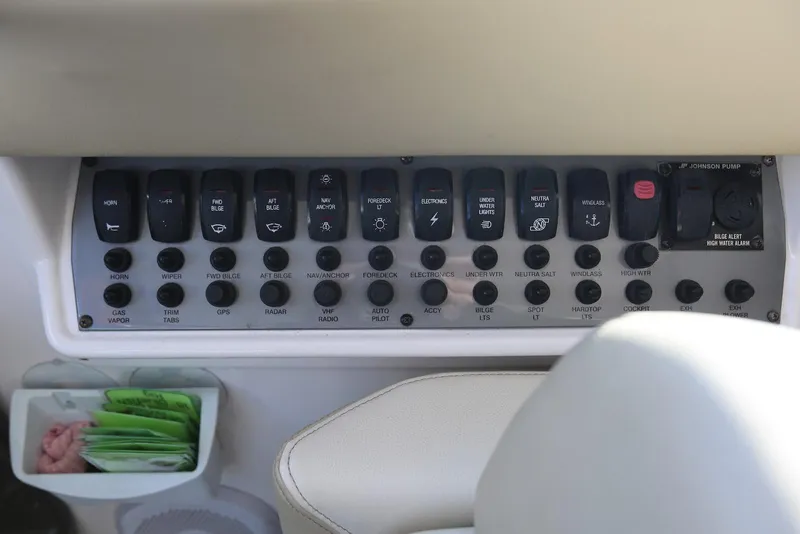 Slide: The Image of Control panel of a 2012 Regal 35 Sport Coupe boat with labeled switches. - 17