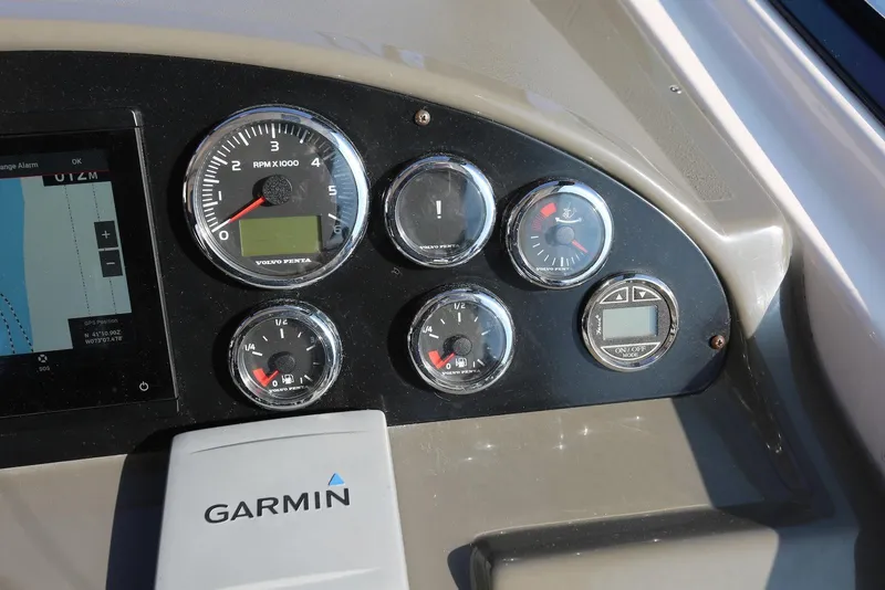 Slide: The Image of Dashboard of 2012 Regal 35 Sport Coupe with Garmin navigation and Volvo Penta gauges. - 33