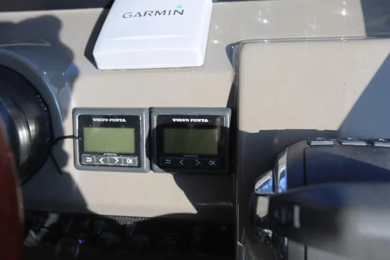 Slide: The Image of Control panel of a 2012 Regal 35 Sport Coupe with Garmin and Volvo Penta displays. - 35
