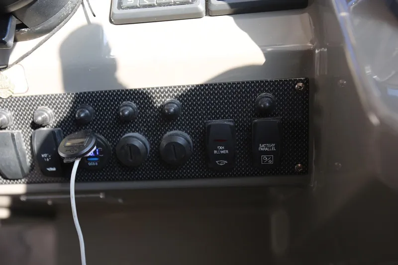 Slide: The Image of Control panel of a 2012 Regal 35 Sport Coupe with switches and USB port. - 37